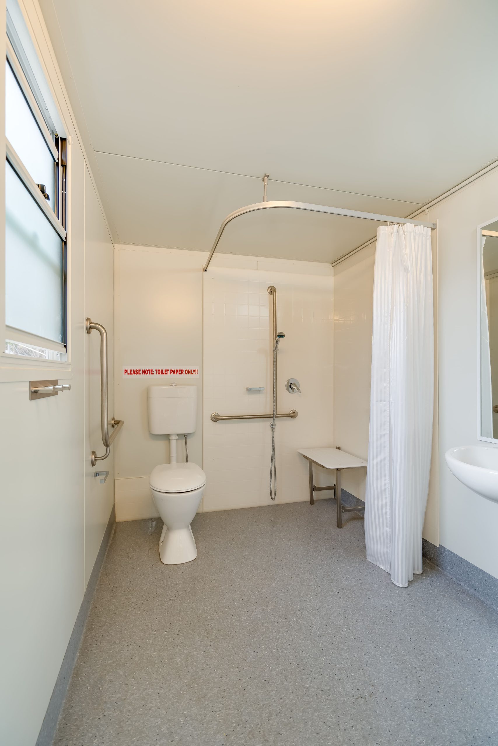 Interior of Access POD Home Care AS1428 compliant accessible bathroom for residential use